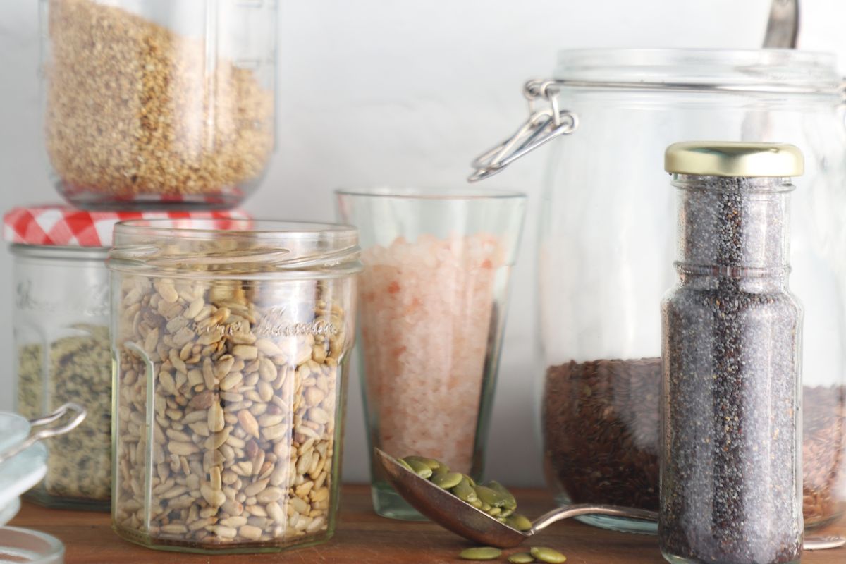 A close-up of a variety of seeds, including chia seeds, showcasing the ingredients used in Ella’s Flats ingredients.